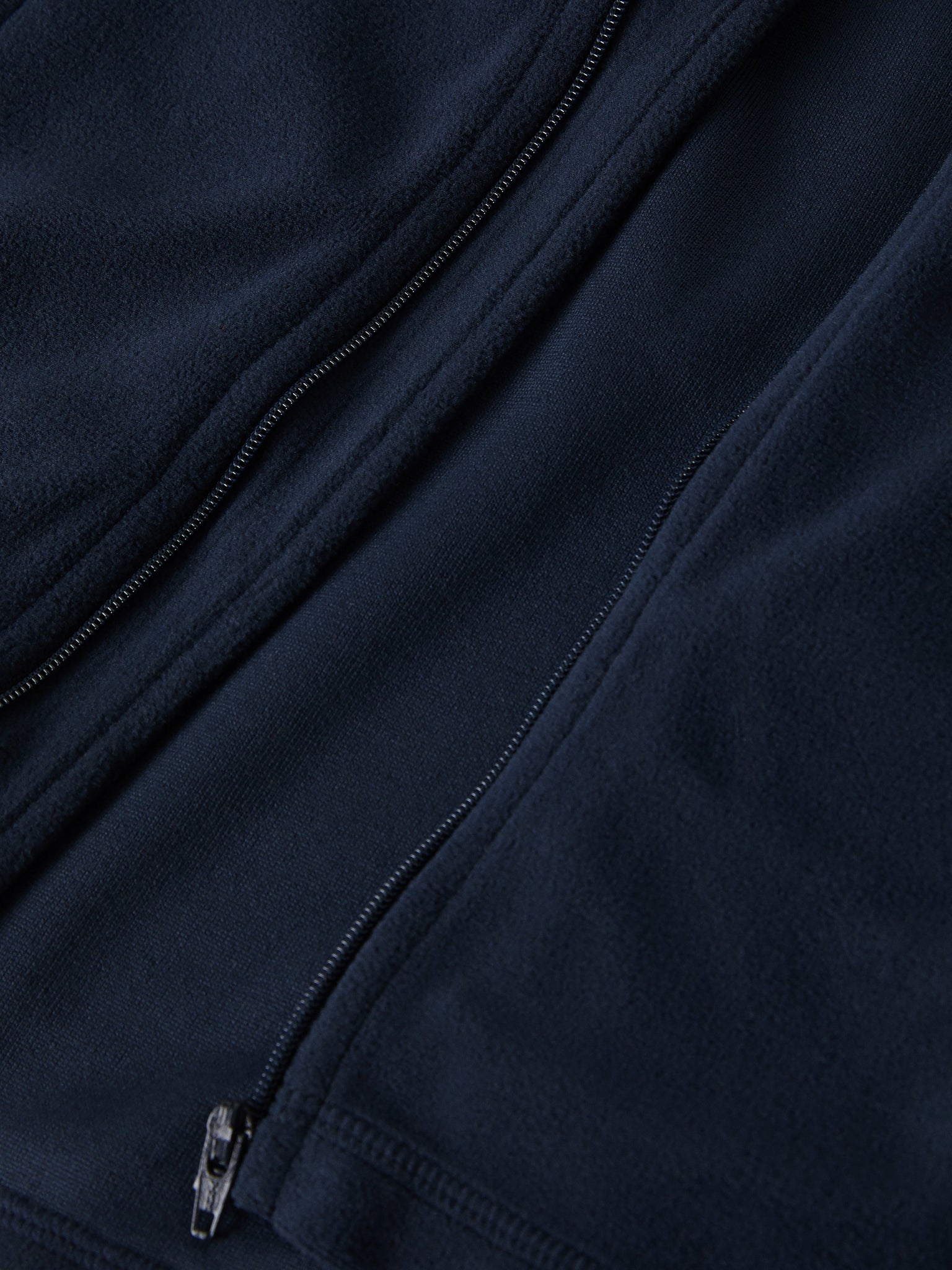 Navy Waterproof Kids Fleece Jacket from the Polarn O. Pyret outerwear collection. Ethically produced kids outerwear.