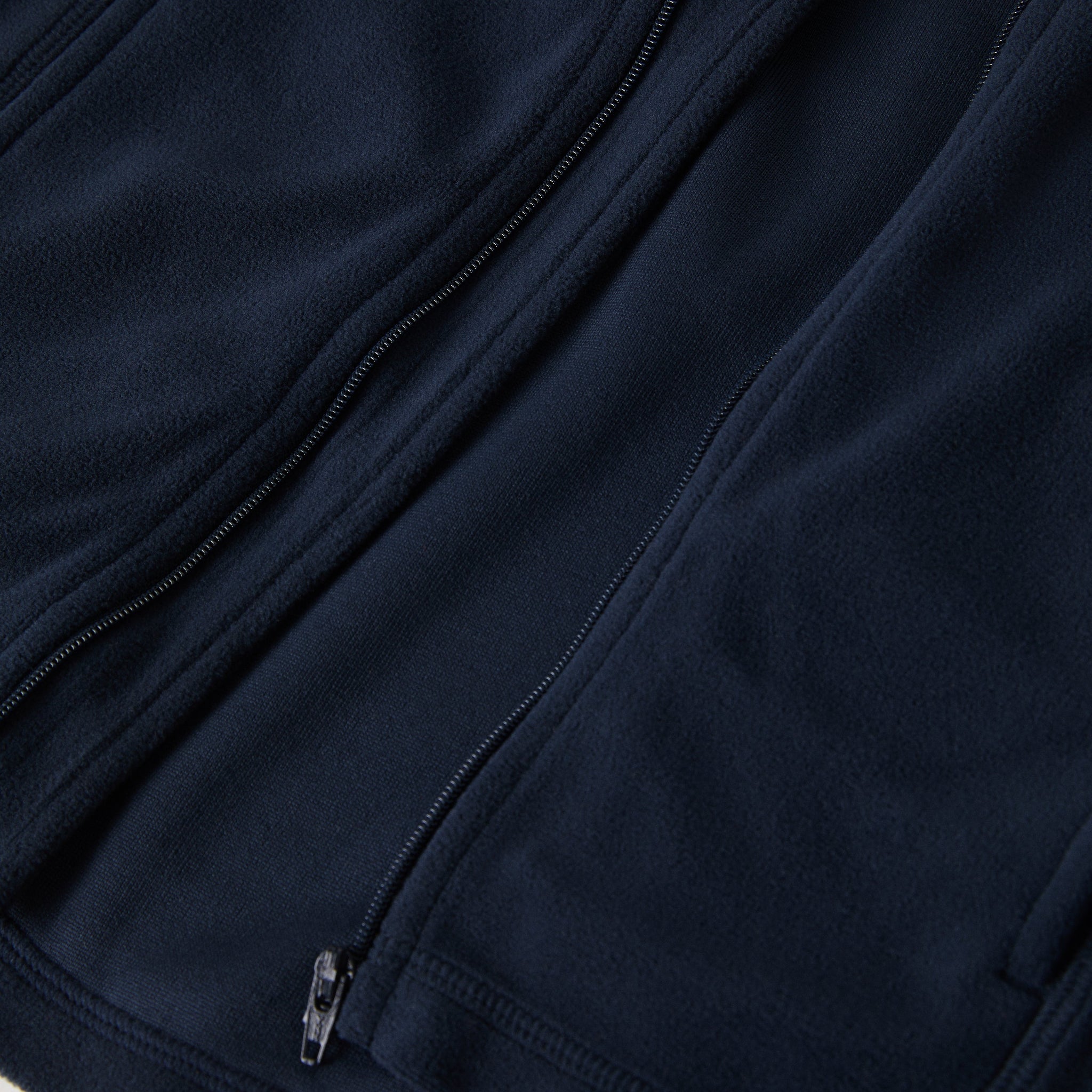 Navy Waterproof Kids Fleece Jacket from the Polarn O. Pyret outerwear collection. Ethically produced kids outerwear.