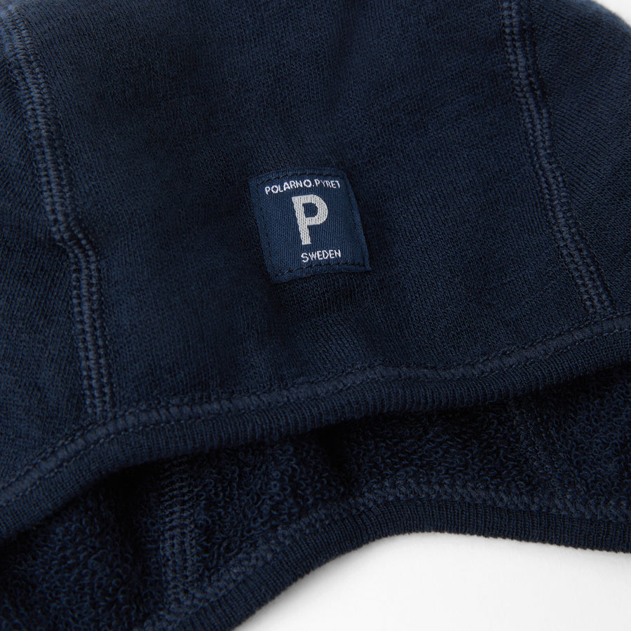 Navy Merino Wool Baby Hat from the Polarn O. Pyret outerwear collection. Kids outerwear made from sustainably source materials