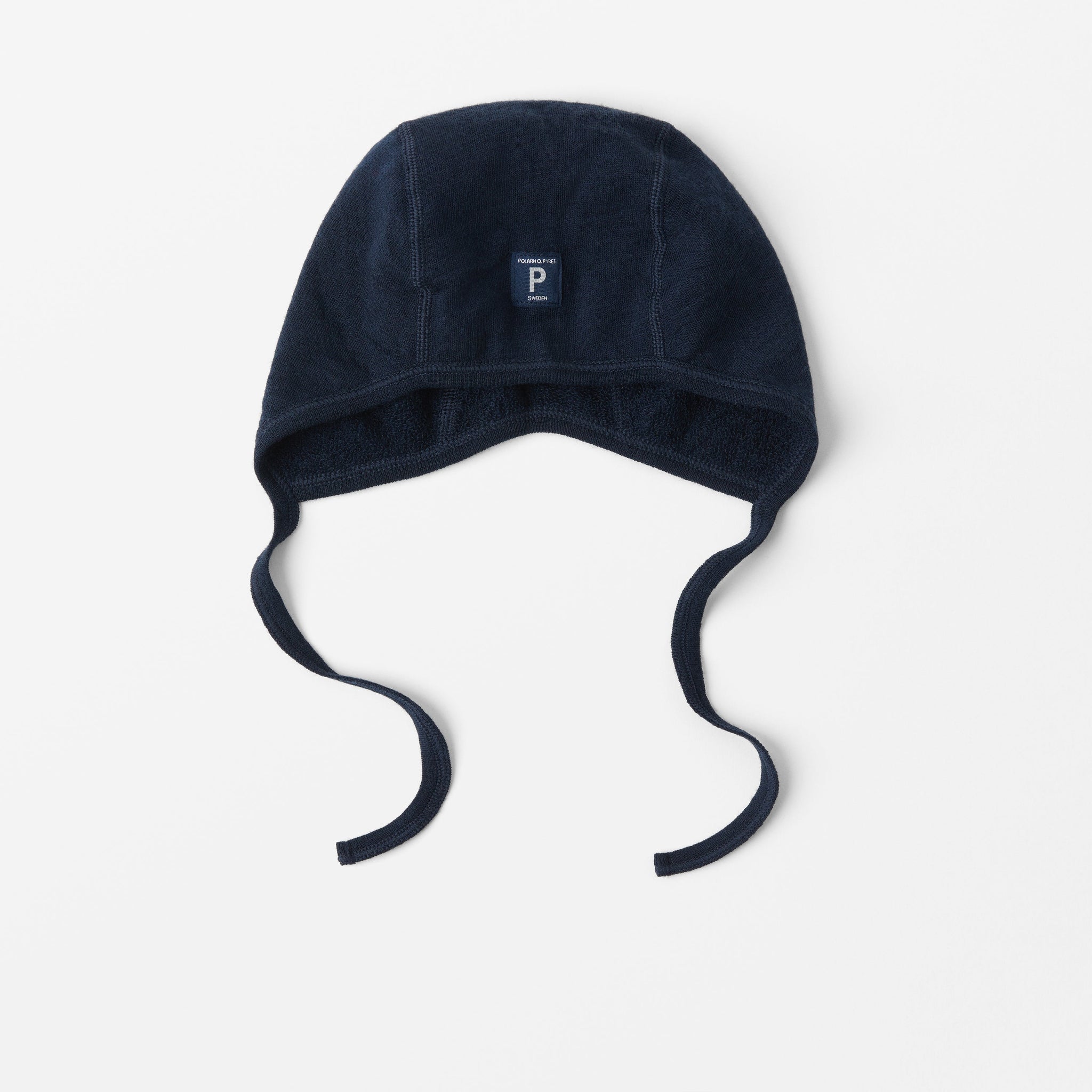 Navy Merino Wool Baby Hat from the Polarn O. Pyret outerwear collection. Kids outerwear made from sustainably source materials