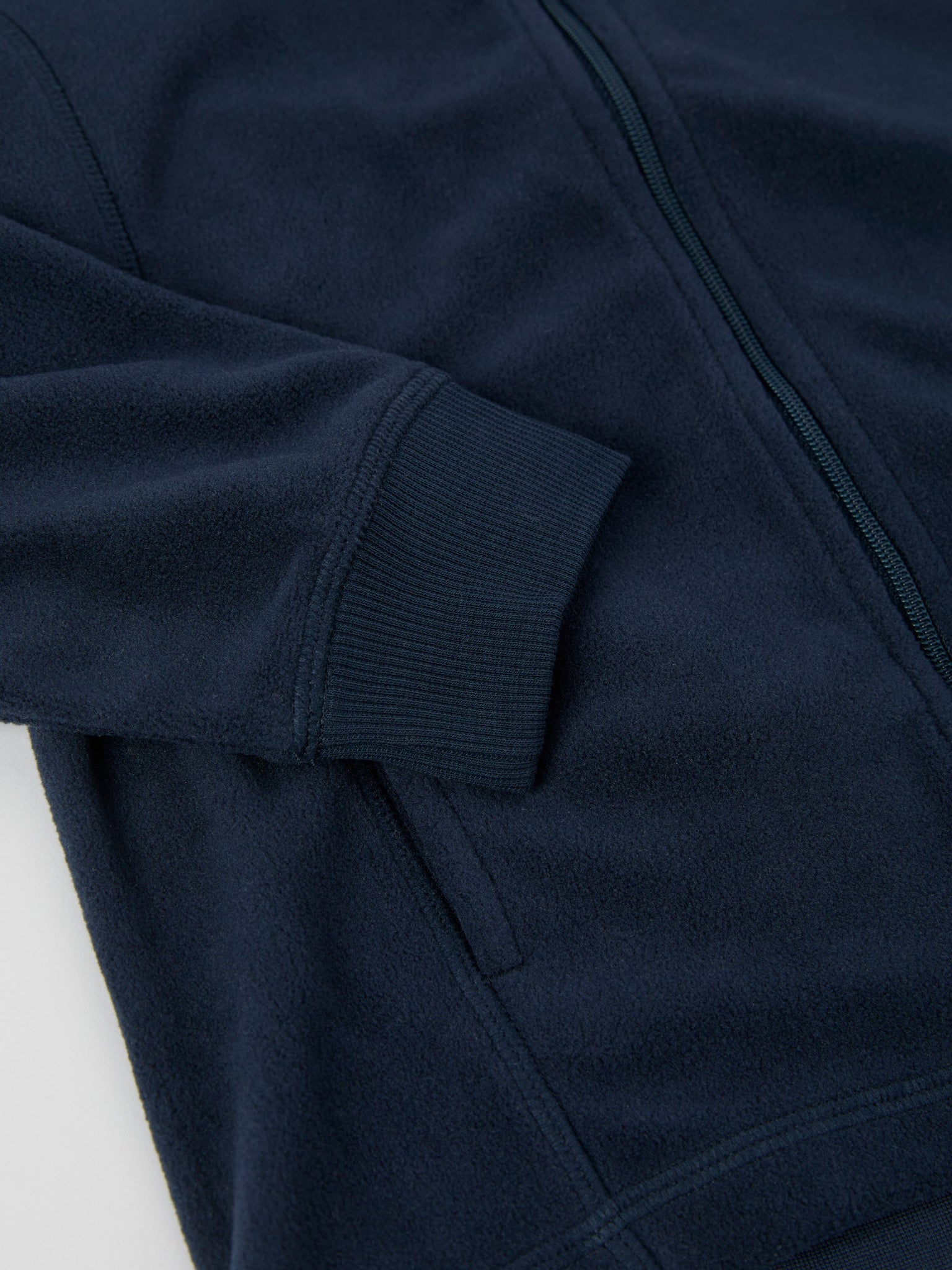 Navy Waterproof Kids Fleece Jacket from the Polarn O. Pyret outerwear collection. Ethically produced kids outerwear.