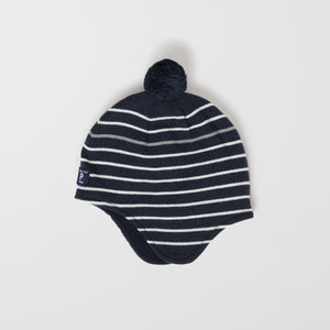 Merino Wool Navy Kids Bobble Hat from the Polarn O. Pyret outerwear collection. Ethically produced kids outerwear.