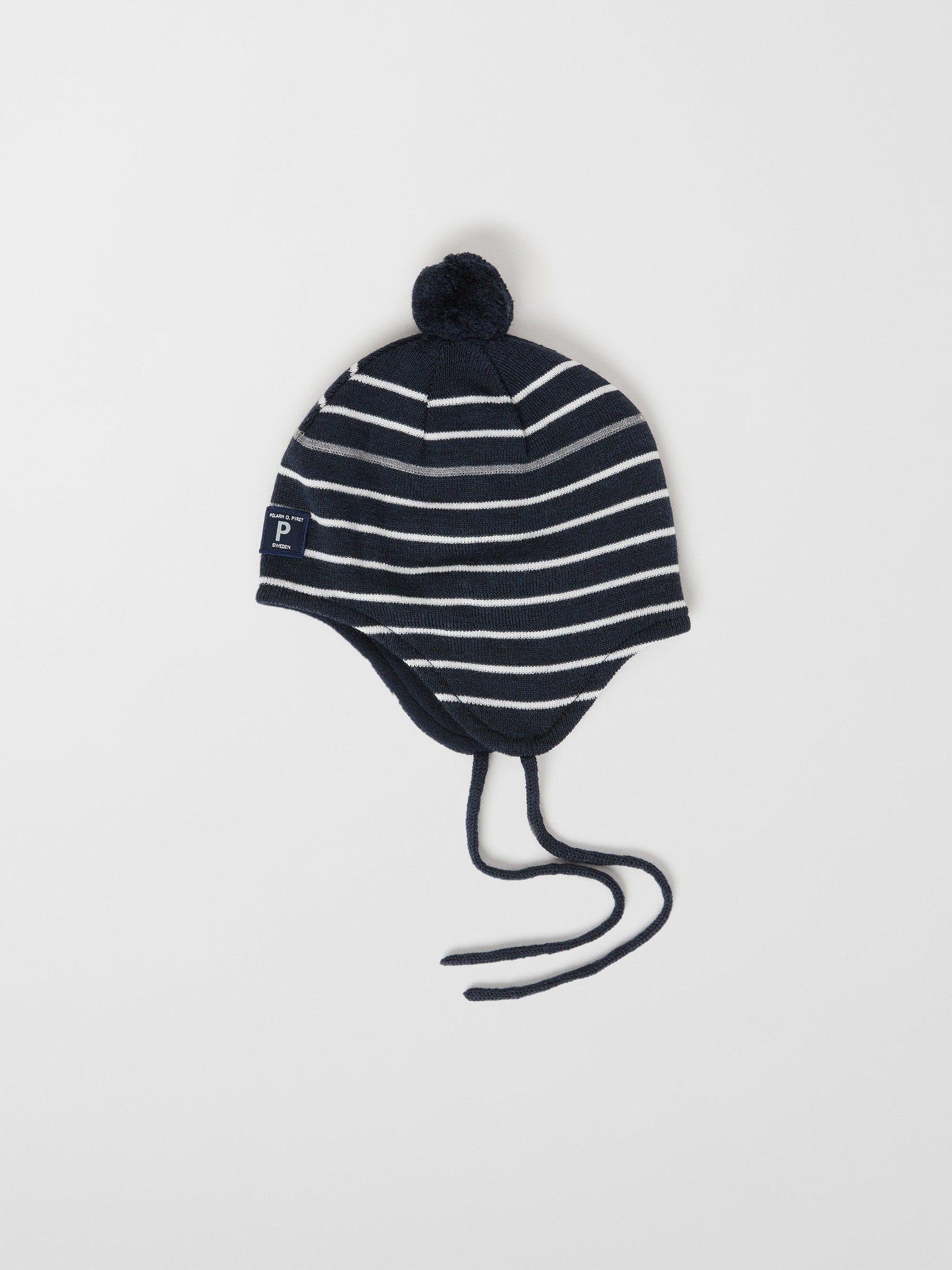 Merino Wool Navy Kids Bobble Hat from the Polarn O. Pyret outerwear collection. Ethically produced kids outerwear.