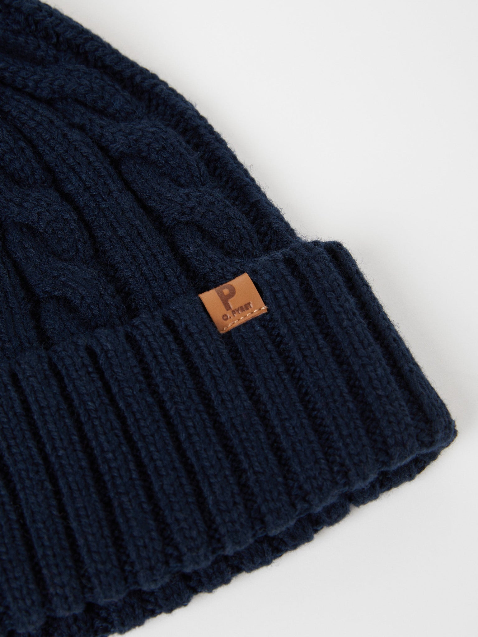 Wool Kids Navy Bobble Hat from the Polarn O. Pyret outerwear collection. Made using ethically sourced materials.