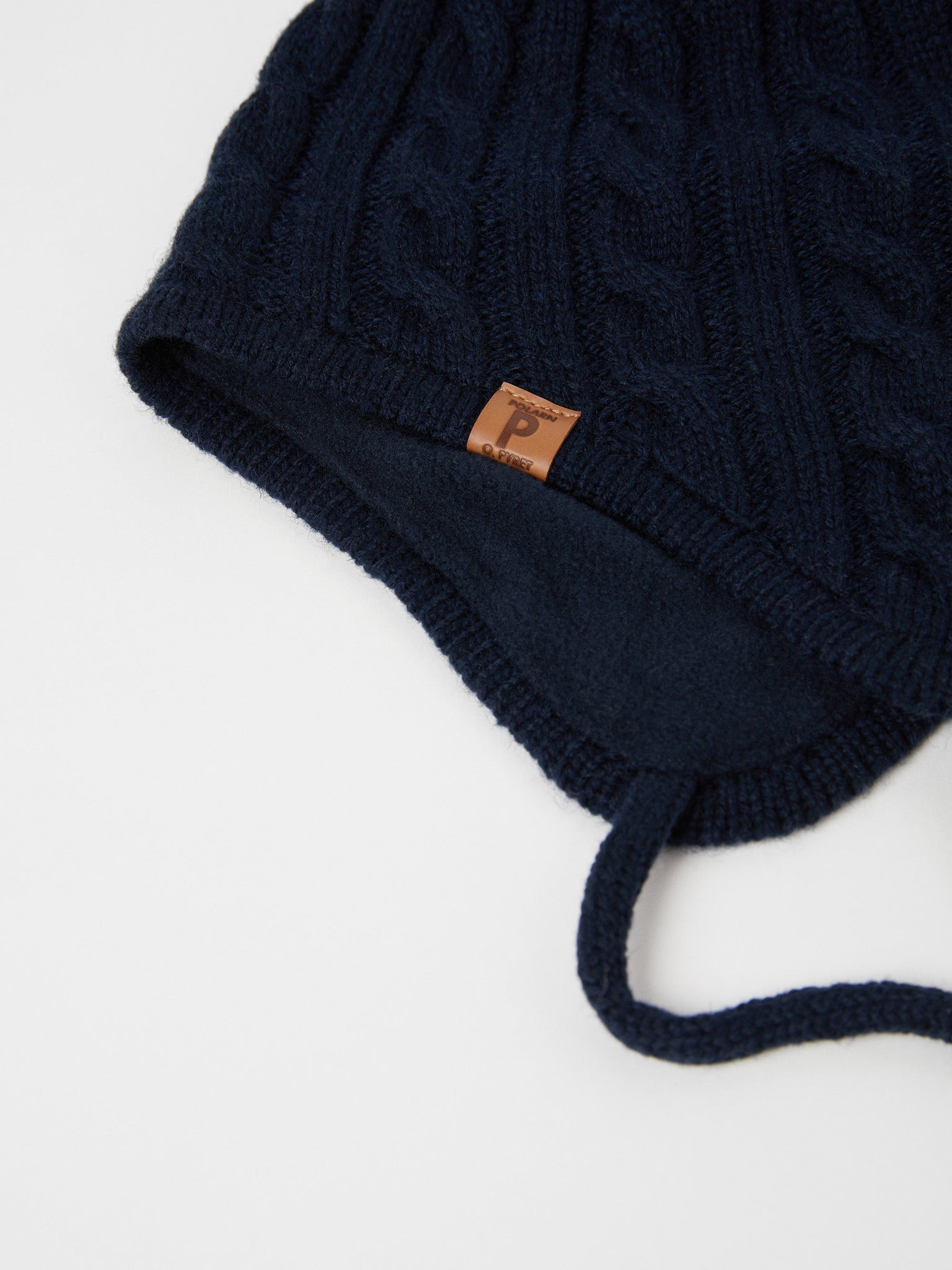 Wool Kids Navy Bobble Hat from the Polarn O. Pyret outerwear collection. Made using ethically sourced materials.