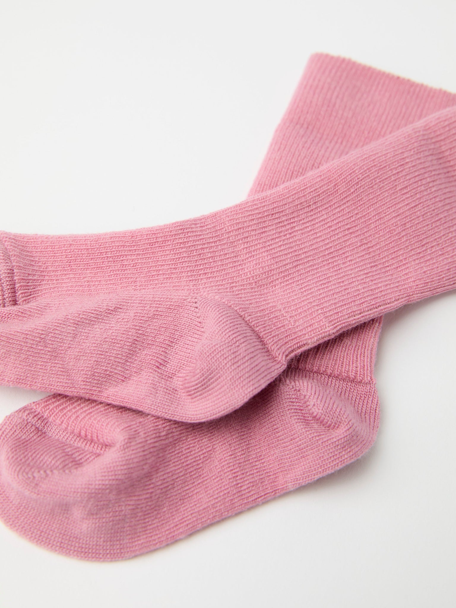 Pink Merino Baby Socks from the Polarn O. Pyret baby collection. Clothes made using sustainably sourced materials.