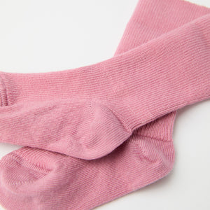 Pink Merino Baby Socks from the Polarn O. Pyret baby collection. Clothes made using sustainably sourced materials.