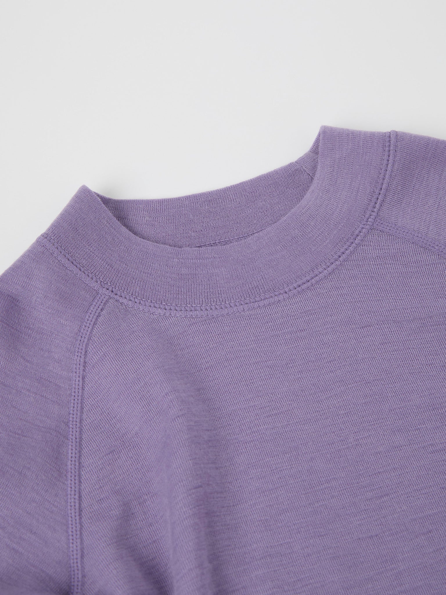 Purple Thermal Merino Kids Top from the Polarn O. Pyret kidswear collection. The best ethical kids outerwear.