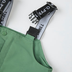 Green Waterproof Kids Shell Dungarees from the Polarn O. Pyret kidswear collection. The best ethical kids outerwear.