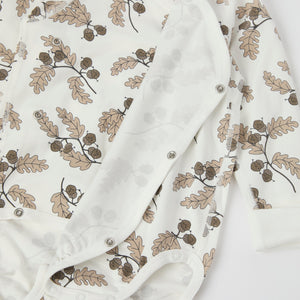 Acorn Print Wraparound Babygrow from the Polarn O. Pyret baby collection. Nordic kids clothes made from sustainable sources.