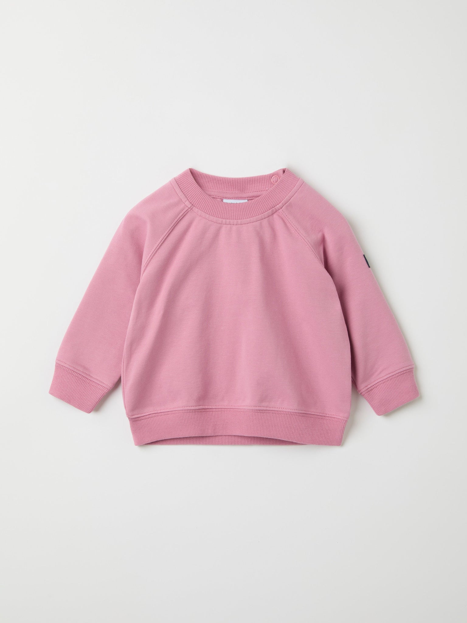 Pink Cotton Baby Sweatshirt from the Polarn O. Pyret baby collection. Nordic kids clothes made from sustainable sources.