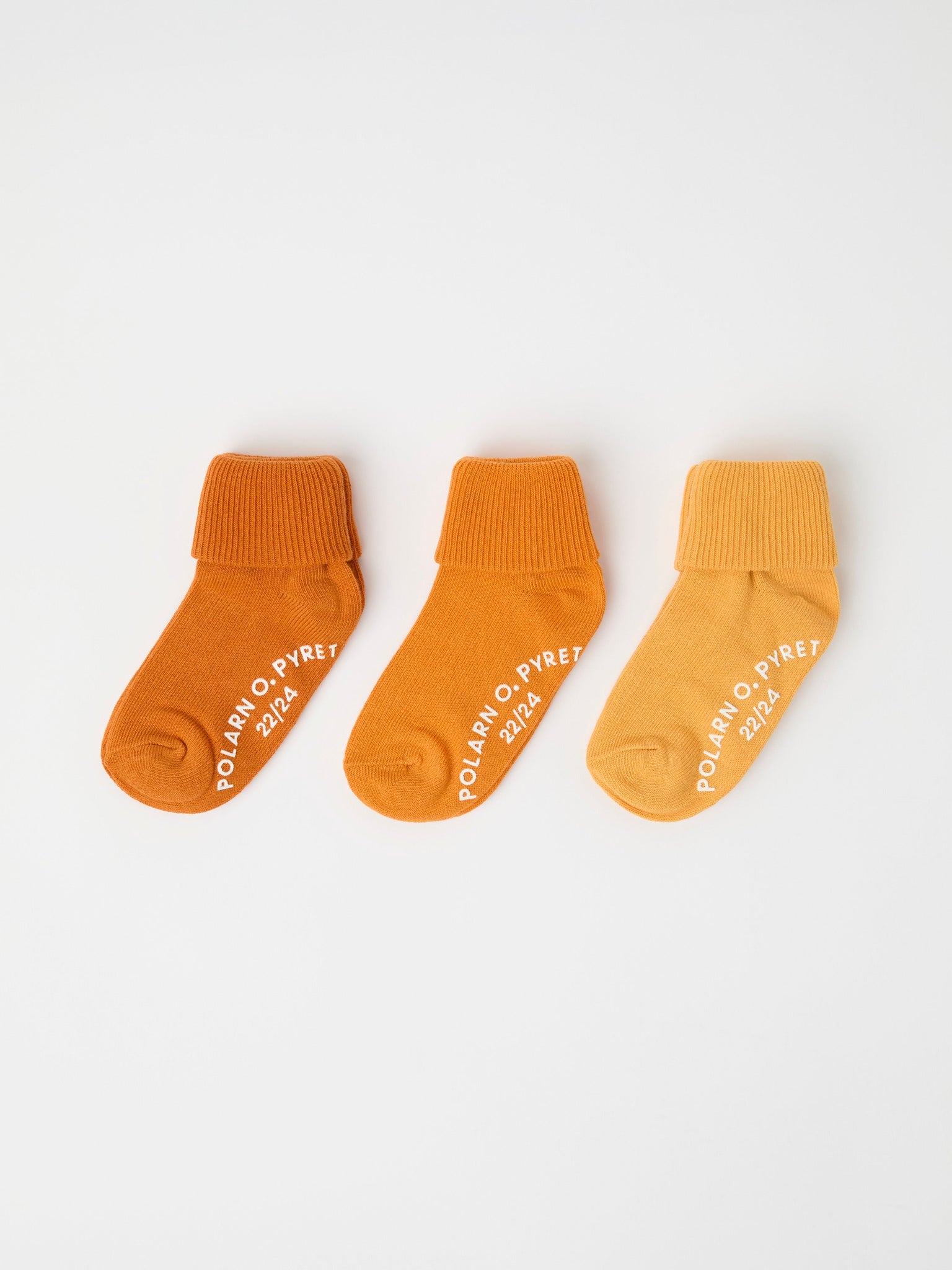 Three Pack Yellow Antislip Kids Socks from Polarn O. Pyret kidswear. Ethically produced kids clothing.