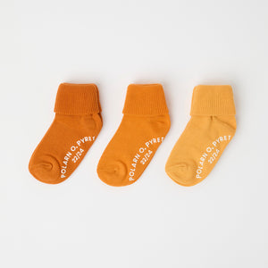 Three Pack Yellow Antislip Kids Socks from Polarn O. Pyret kidswear. Ethically produced kids clothing.