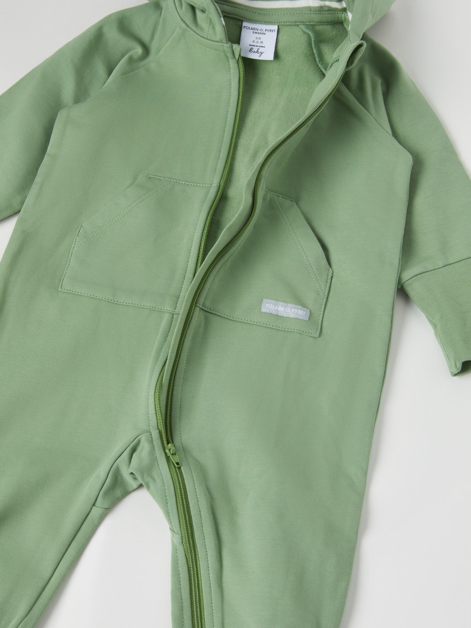 Green Organic Cotton Sweatshirt Baby All-in-one from the Polarn O. Pyret baby collection. Nordic kids clothes made from sustainable sources.