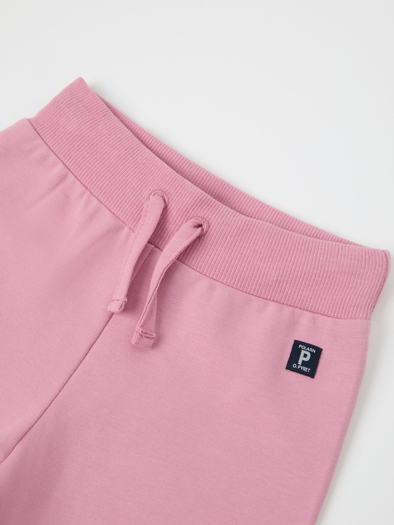 Pink Organic Cotton Baby Joggers from the Polarn O. Pyret baby collection. Nordic kids clothes made from sustainable sources.