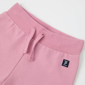 Pink Organic Cotton Baby Joggers from the Polarn O. Pyret baby collection. Nordic kids clothes made from sustainable sources.