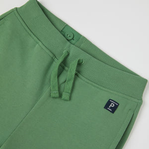 Green Organic Kids Joggers from Polarn O. Pyret kidswear. Clothes made using sustainably sourced materials.