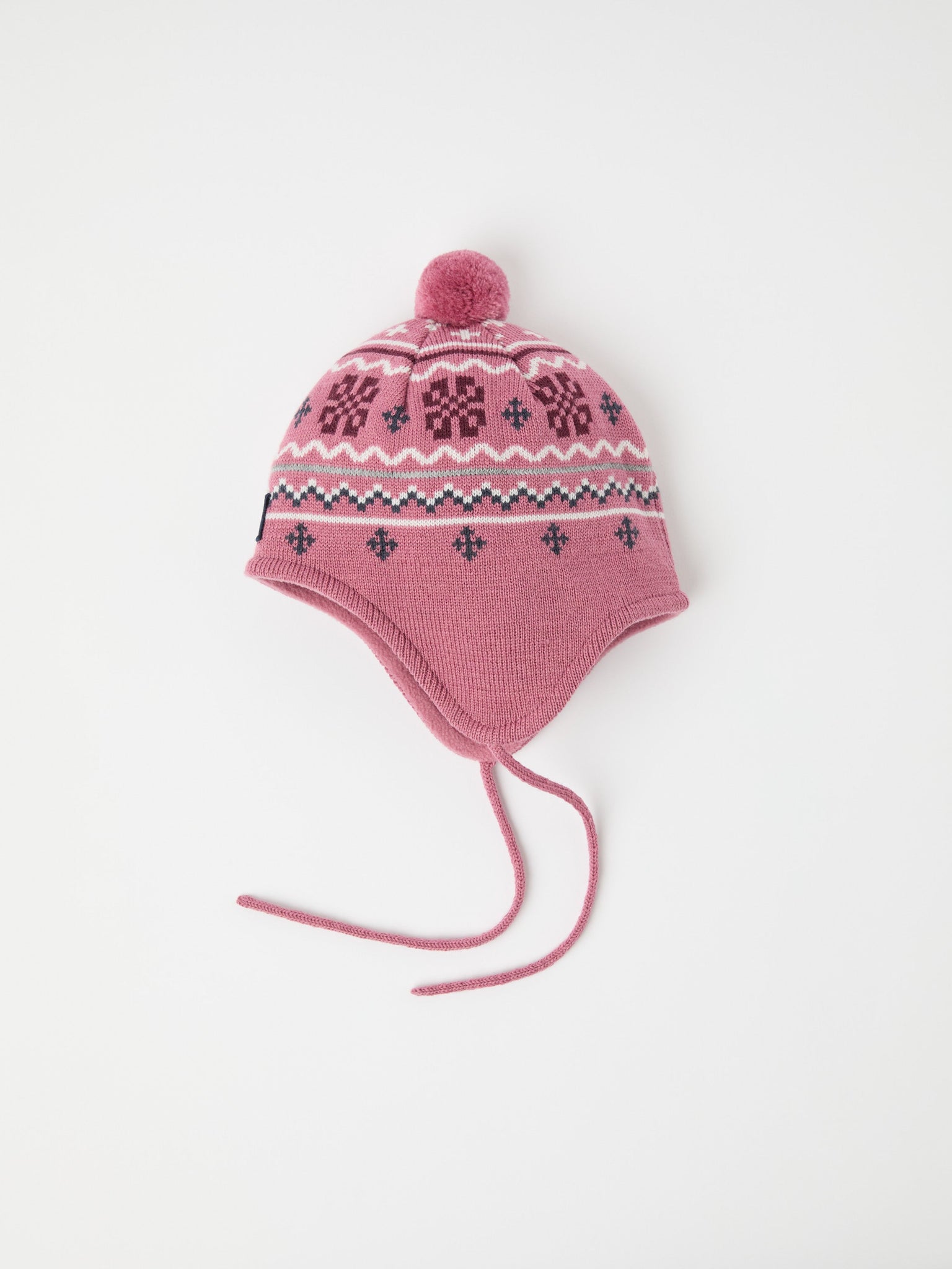 Pink Merino Wool Kids Bobble Hat from the Polarn O. Pyret kidswear collection. Ethically produced kids outerwear.