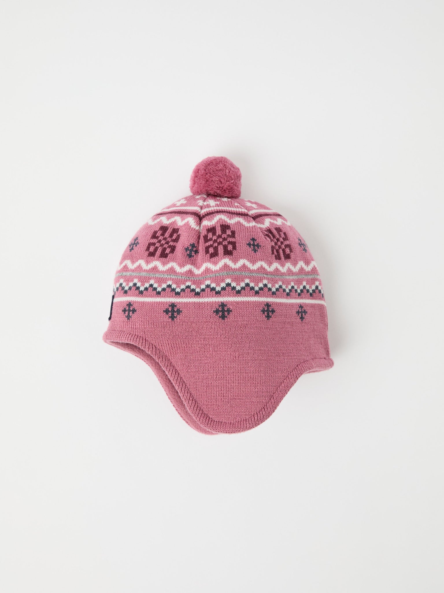 Pink Merino Wool Kids Bobble Hat from the Polarn O. Pyret kidswear collection. Ethically produced kids outerwear.