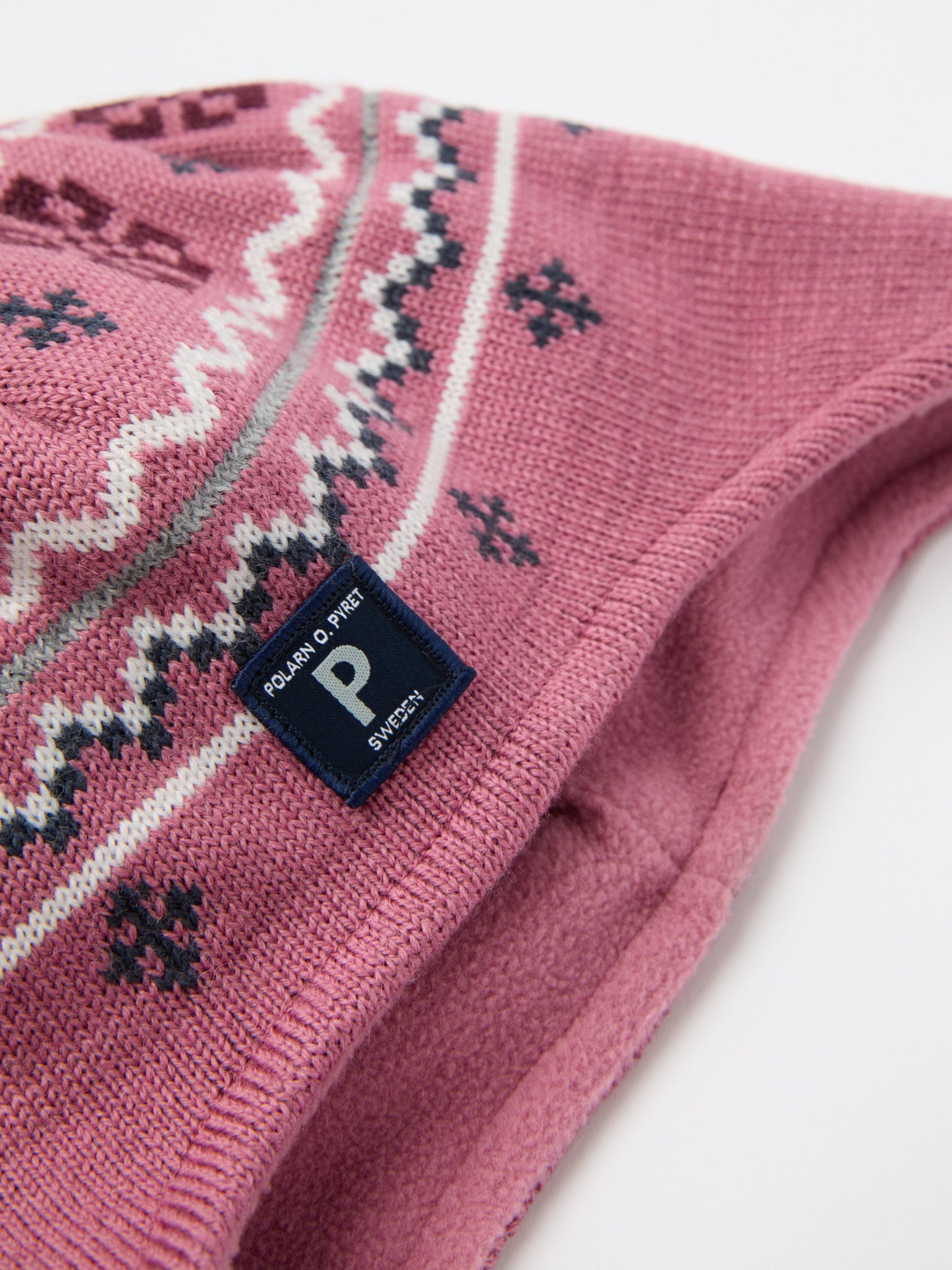 Pink Merino Wool Kids Bobble Hat from the Polarn O. Pyret kidswear collection. Ethically produced kids outerwear.