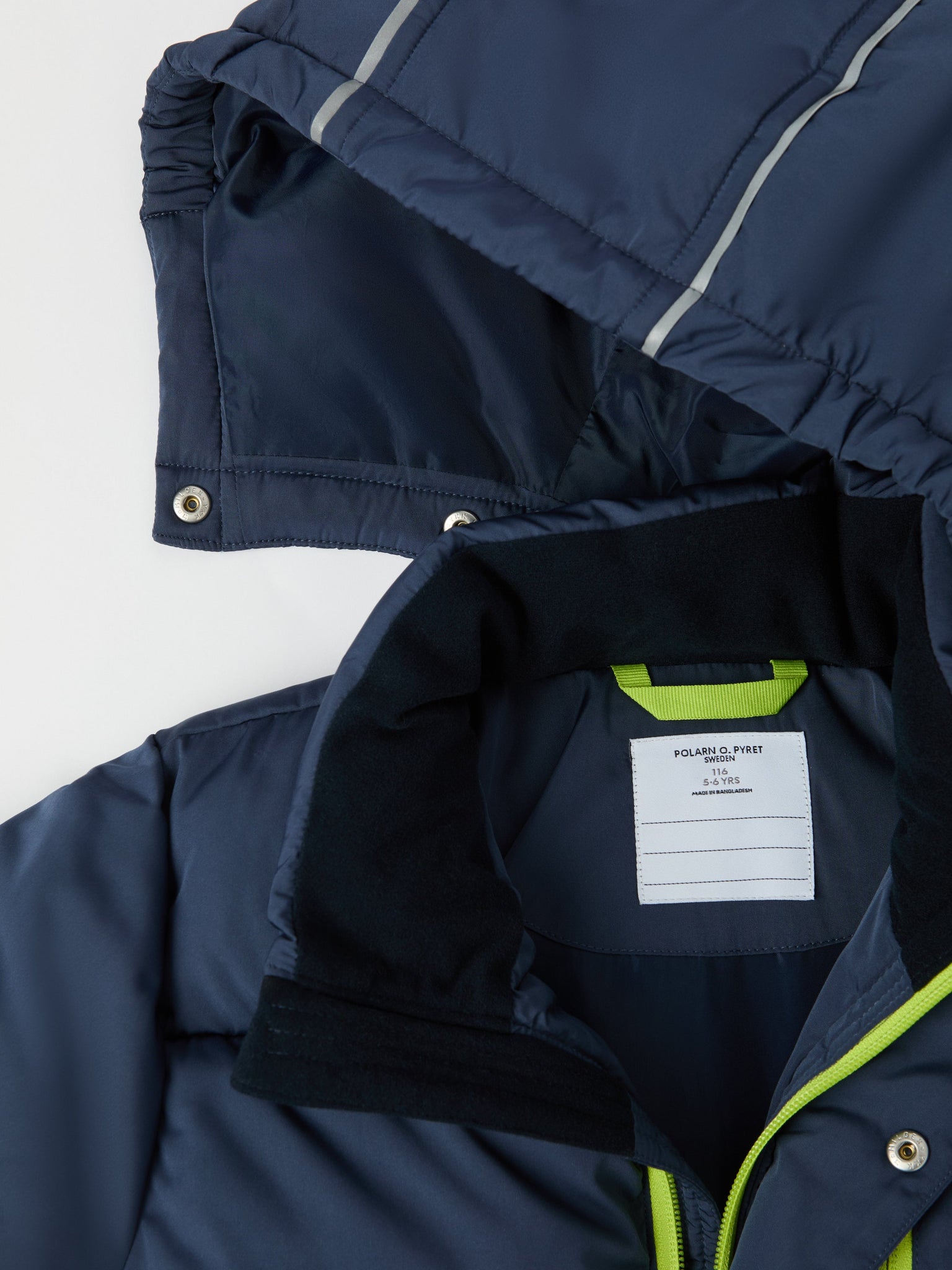 Navy Padded Water Resistant Kids Coat from the Polarn O. Pyret kidswear collection. The best ethical kids outerwear.