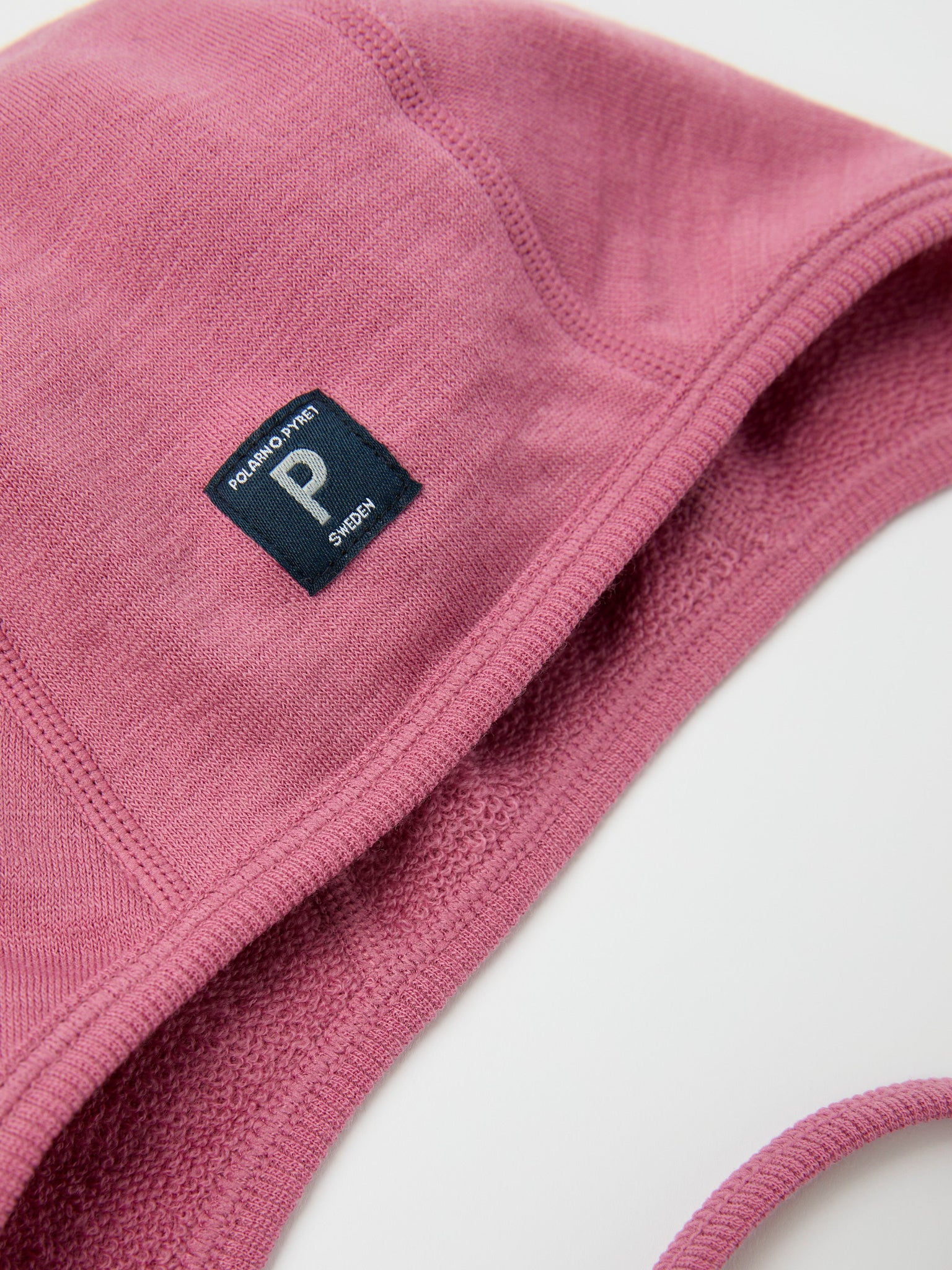 Pink Merino Wool Baby Helmet Hat from the Polarn O. Pyret kidswear collection. The best ethical kids outerwear.