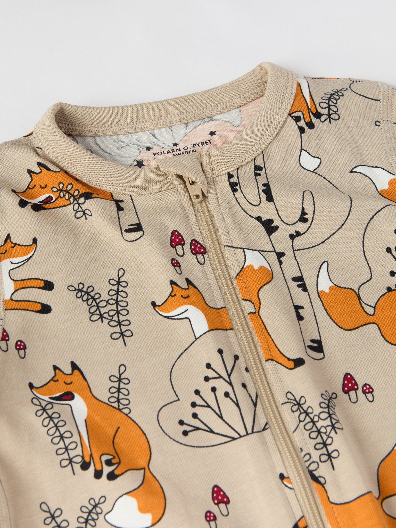 Fox Print Organic Cotton Baby Sleepsuit from the Polarn O. Pyret baby collection. Clothes made using sustainably sourced materials.