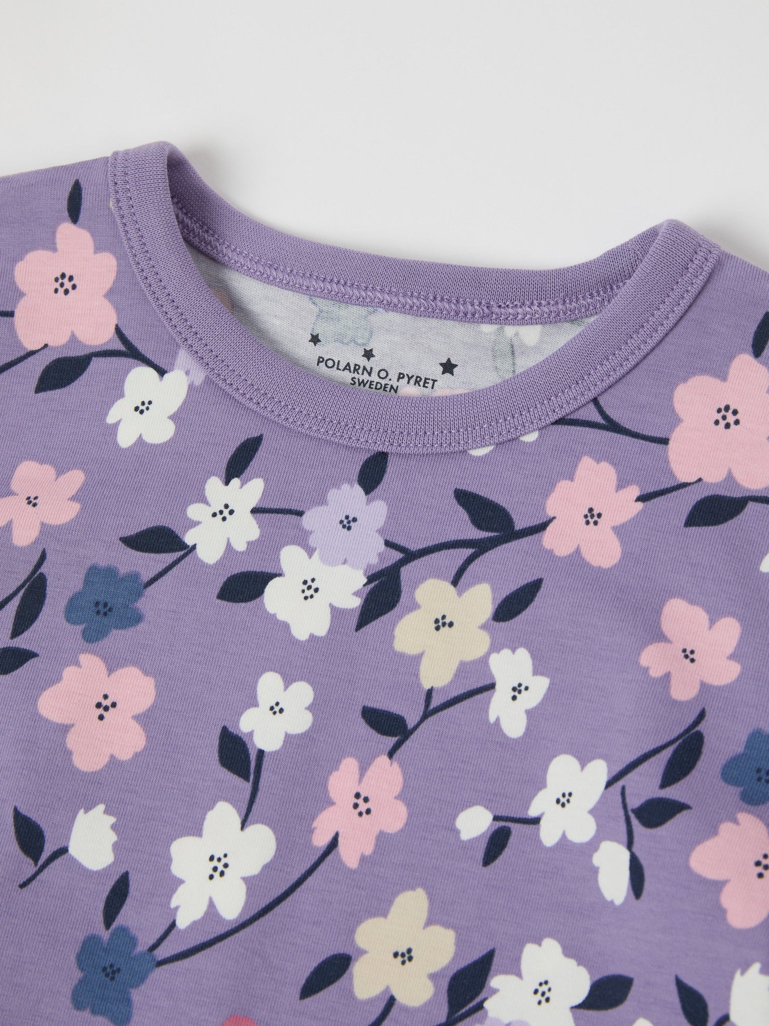 Floral Print Kids Pyjamas from the Polarn O. Pyret kidswear collection. Ethically produced kids clothing.