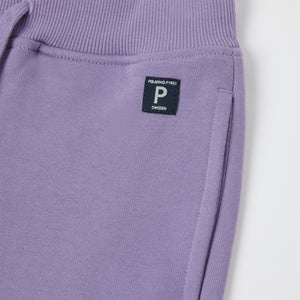 Purple Organic Cotton Kids Joggers from the Polarn O. Pyret kidswear collection. Nordic kids clothes made from sustainable sources.