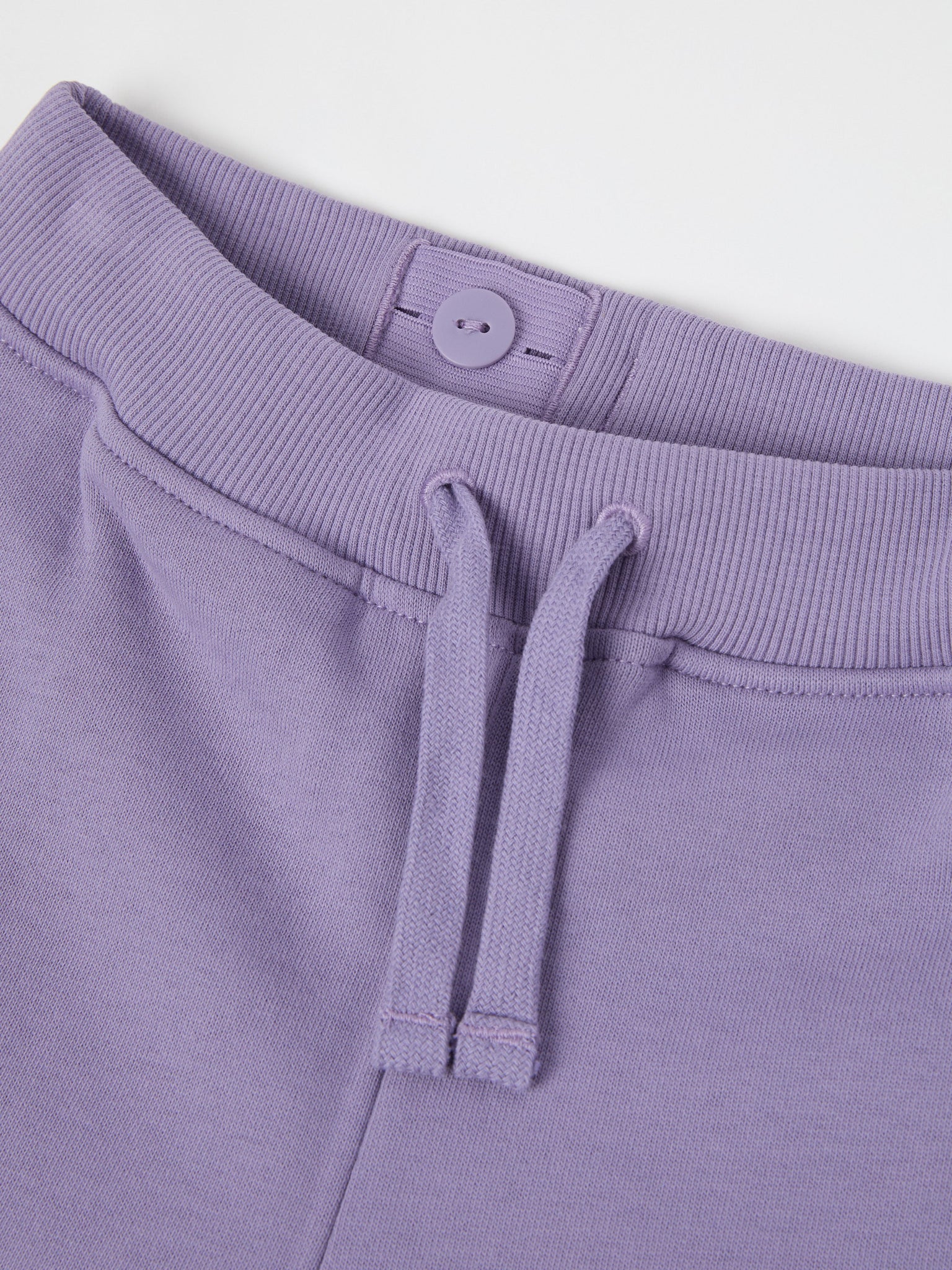 Purple Organic Cotton Kids Joggers from the Polarn O. Pyret kidswear collection. Nordic kids clothes made from sustainable sources.