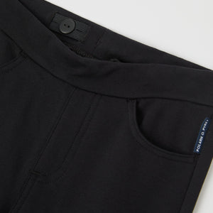 Black Kids Flared Joggers from the Polarn O. Pyret kidswear collection. Clothes made using sustainably sourced materials.