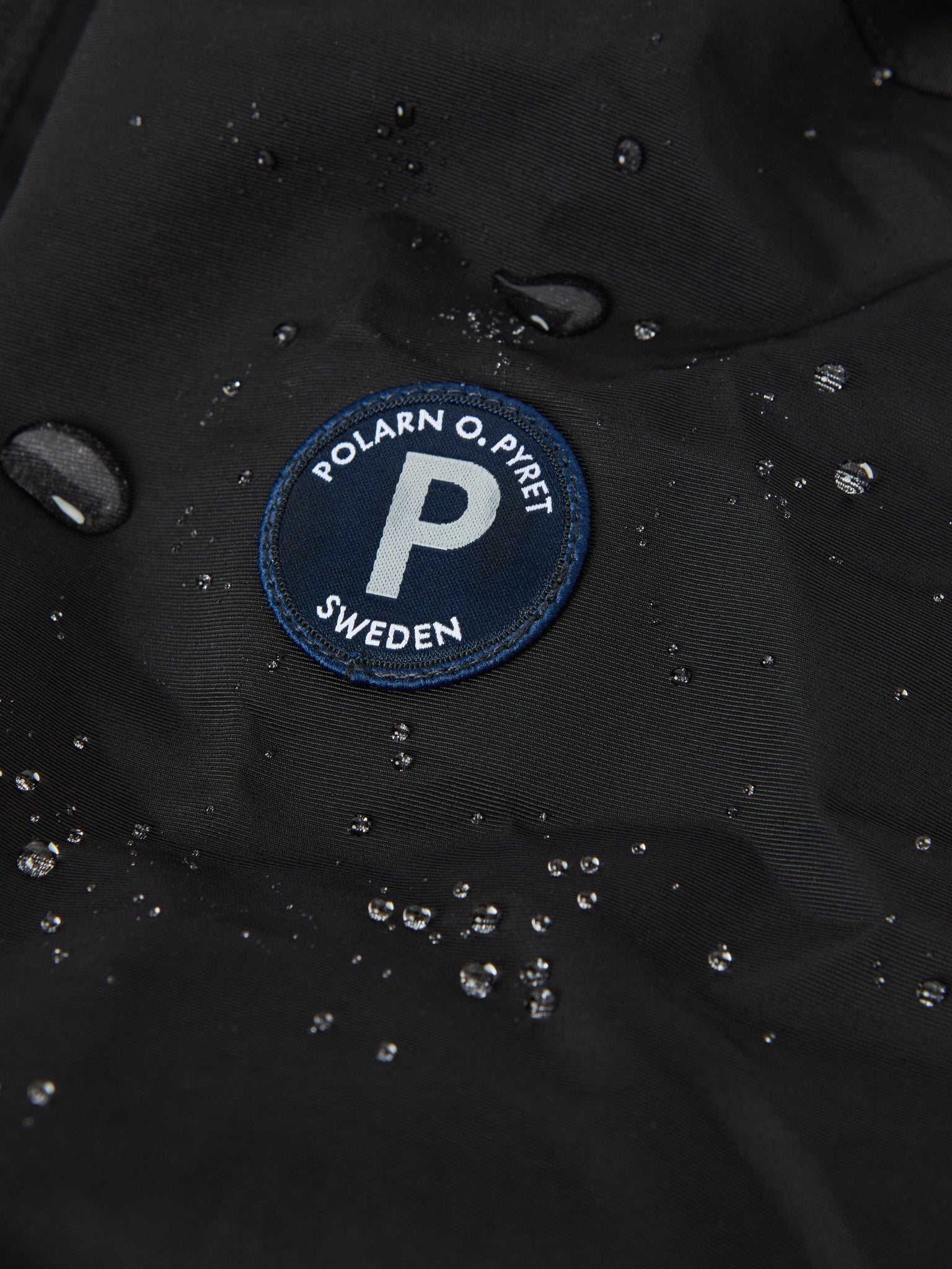 Black Recycled Kids Puddle Suit from the Polarn O. Pyret kidswear collection. Ethically produced kids outerwear.