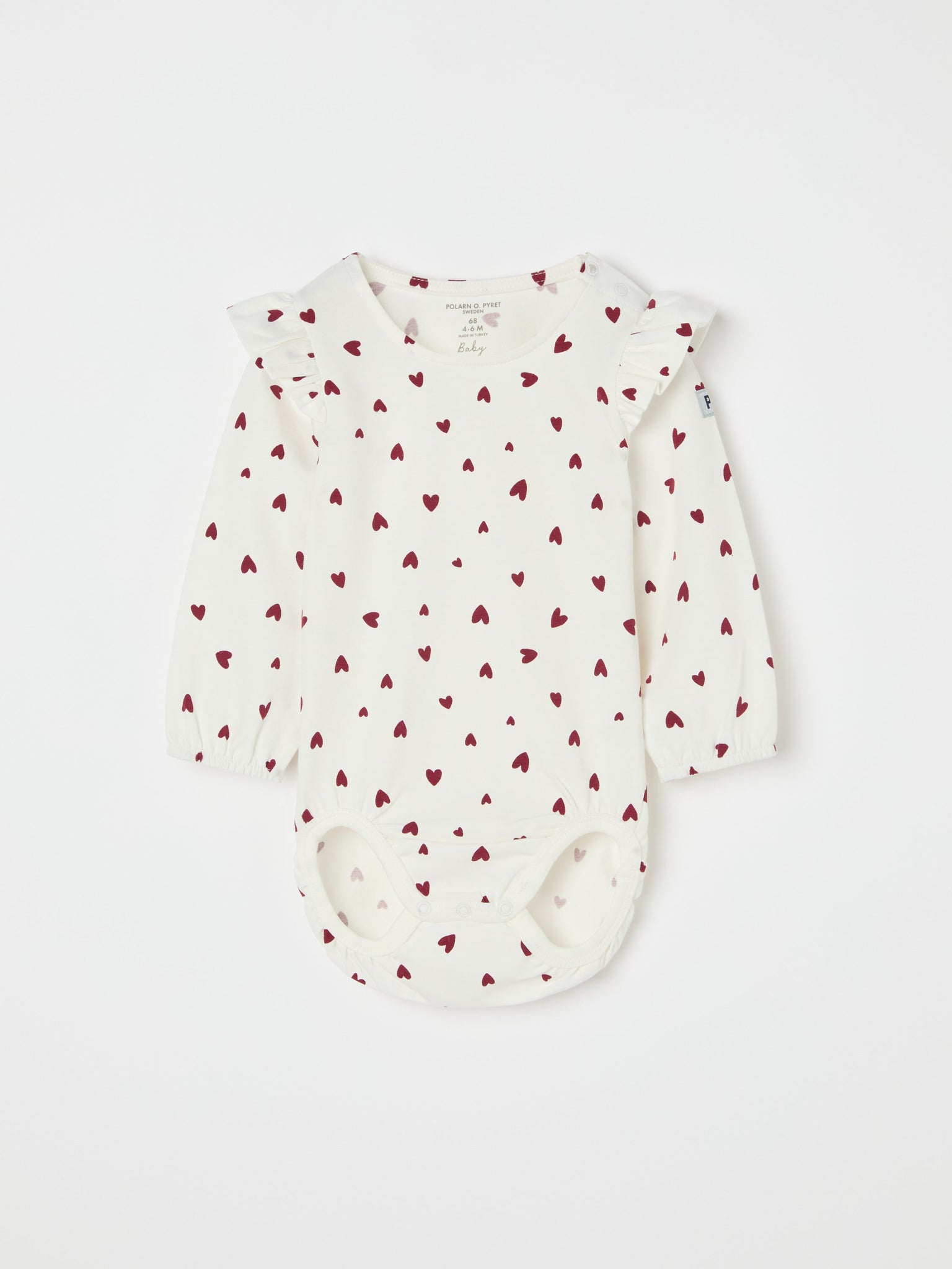 Organic Cotton Heart Print Babygrow from the Polarn O. Pyret baby collection. Ethically produced kids clothing.