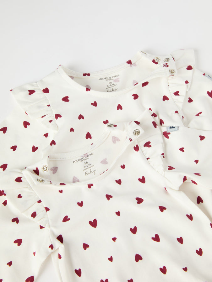 Organic Cotton Heart Print Babygrow from the Polarn O. Pyret baby collection. Ethically produced kids clothing.