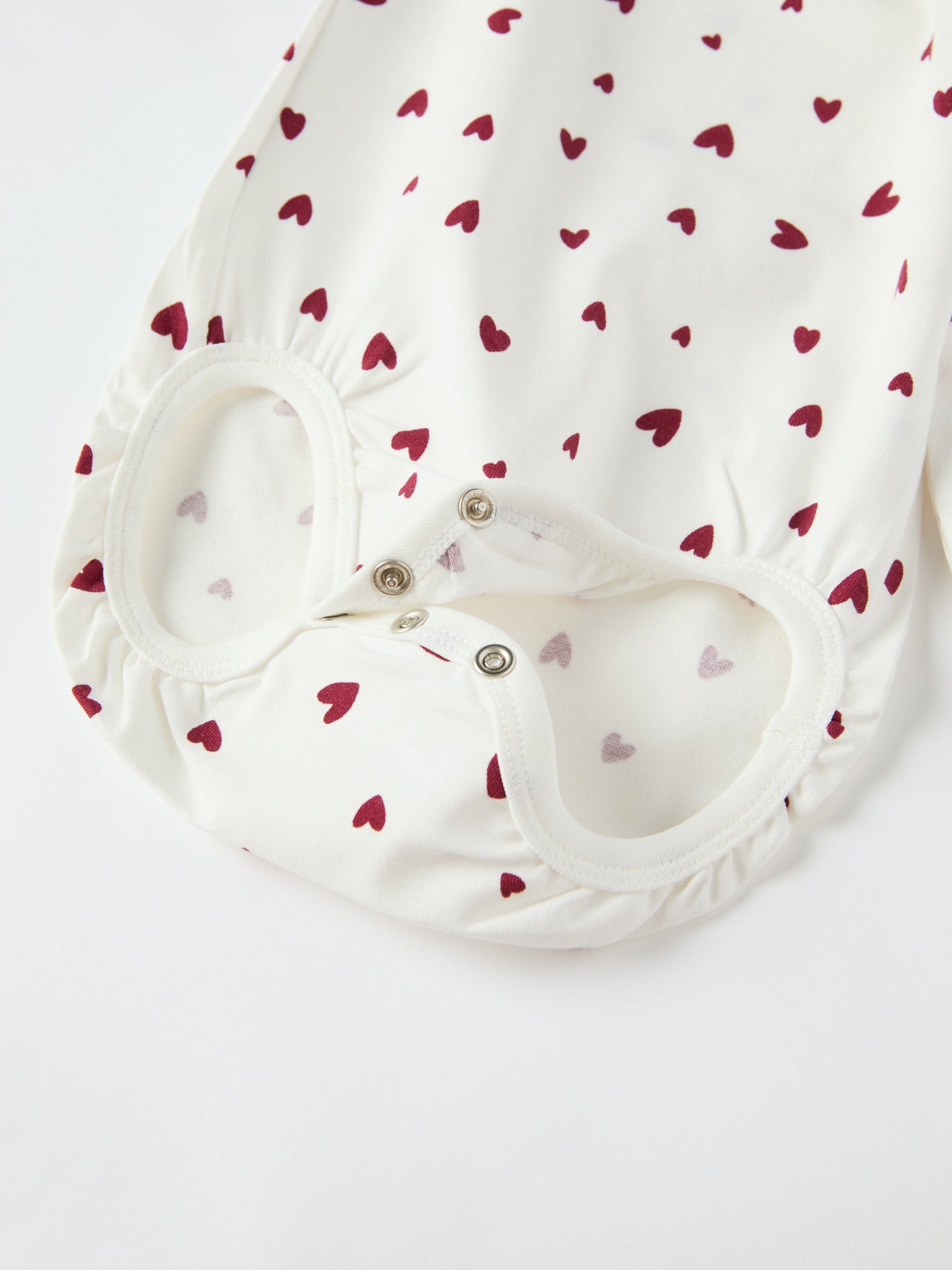 Organic Cotton Heart Print Babygrow from the Polarn O. Pyret baby collection. Ethically produced kids clothing.