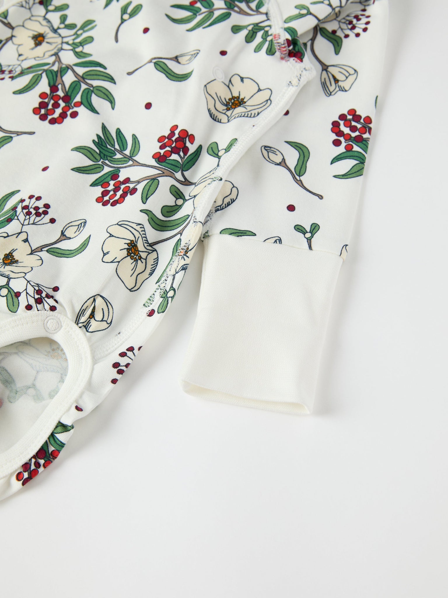 Floral Print Wraparound Babygrow from the Polarn O. Pyret baby collection. Clothes made using sustainably sourced materials.