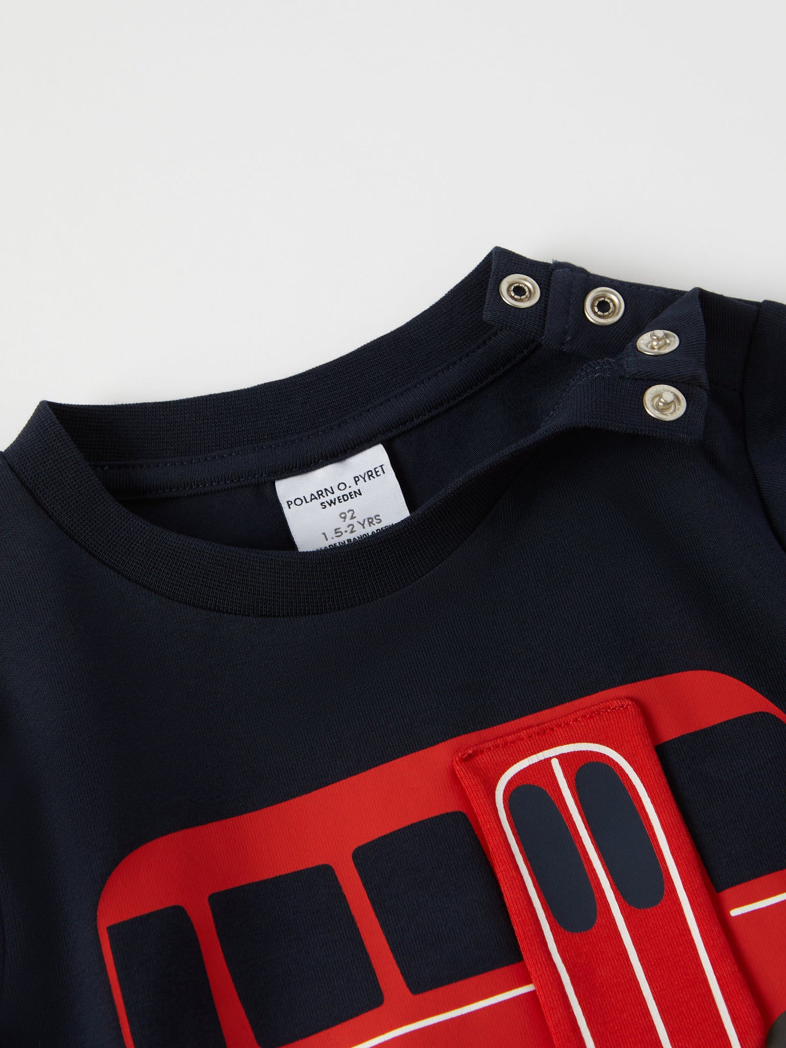 Bus Print Cotton Kids Top from the Polarn O. Pyret kidswear collection. Clothes made using sustainably sourced materials.