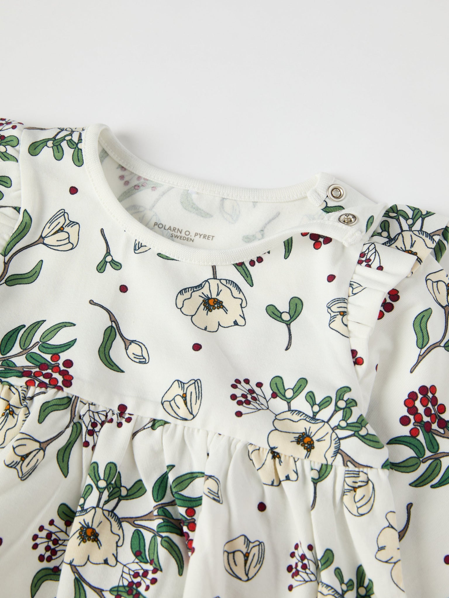 Organic Cotton Floral Print Baby Dress from the Polarn O. Pyret baby collection. Nordic kids clothes made from sustainable sources.