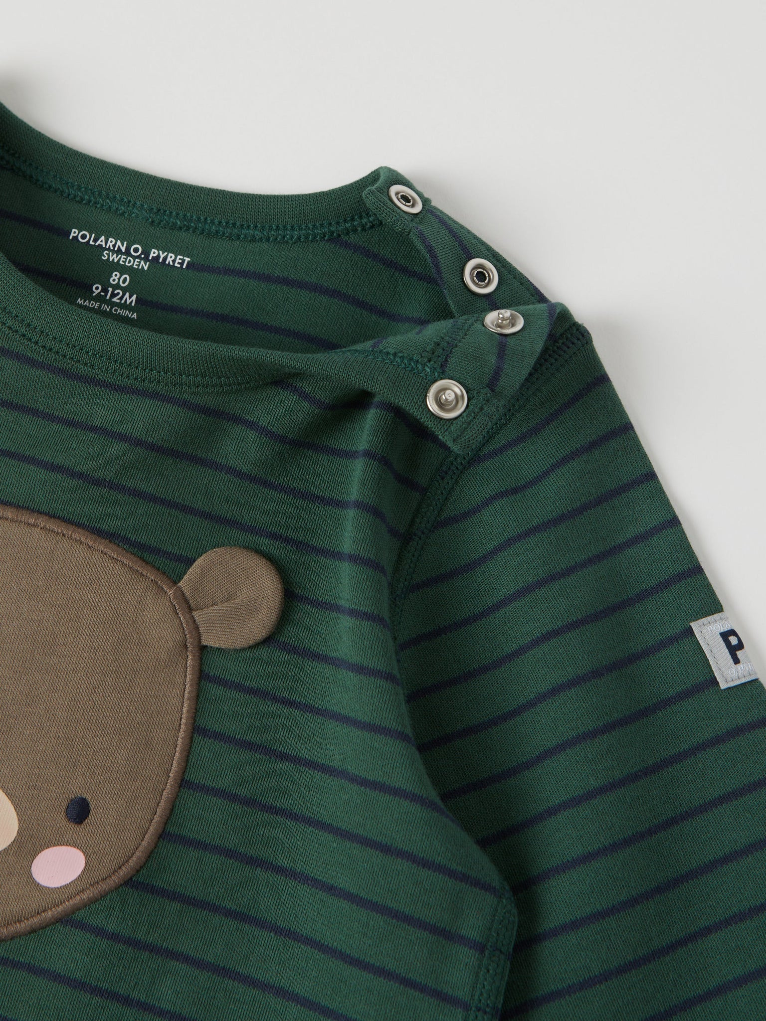 Bear Appliqué Organic Cotton Baby Top from the Polarn O. Pyret baby collection. Clothes made using sustainably sourced materials.