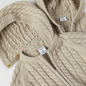 Cable Knit Baby Hooded All-in-one from the Polarn O. Pyret baby collection. Nordic kids clothes made from sustainable sources.