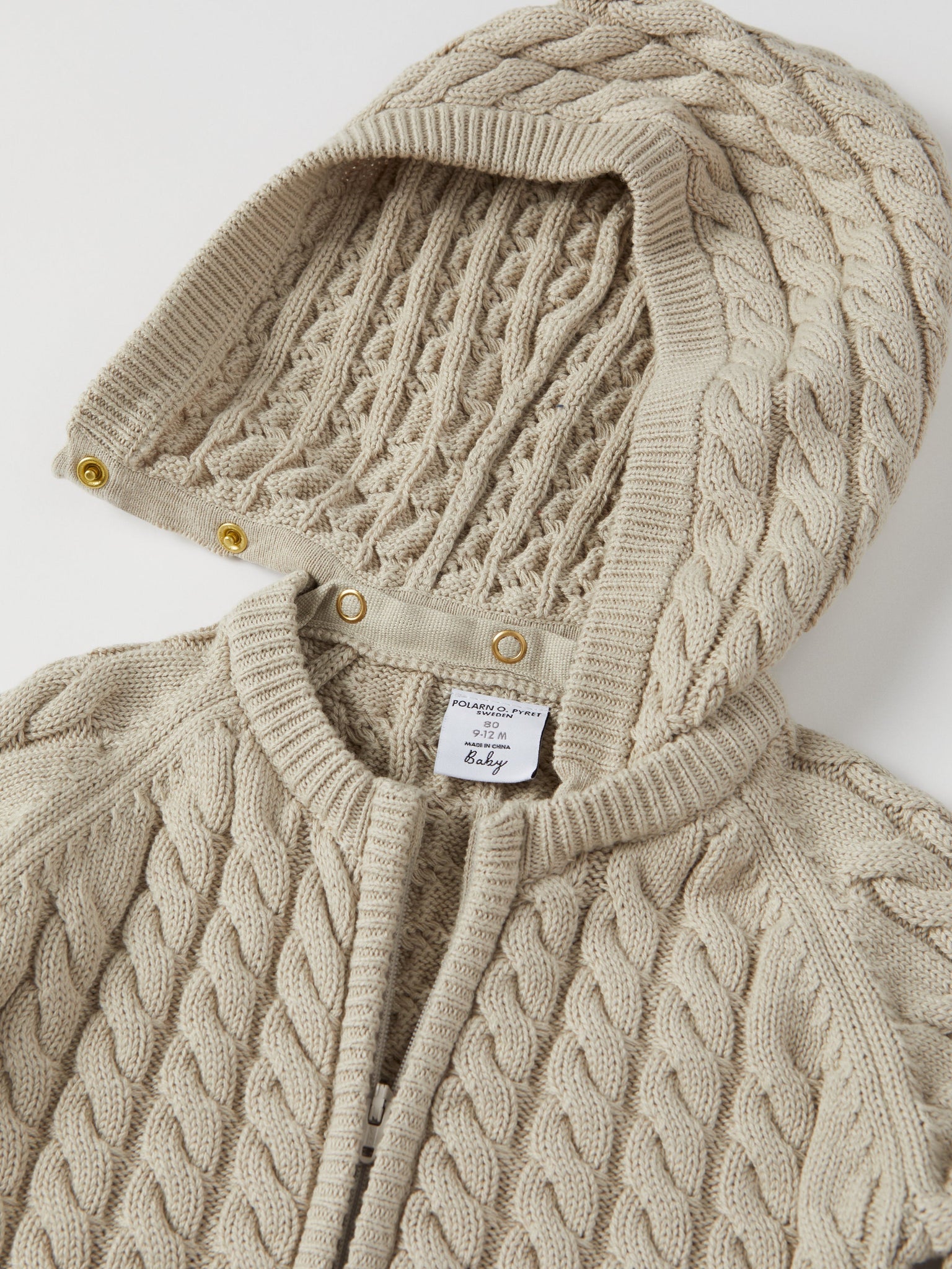 Cable Knit Baby Hooded All-in-one from the Polarn O. Pyret baby collection. Nordic kids clothes made from sustainable sources.