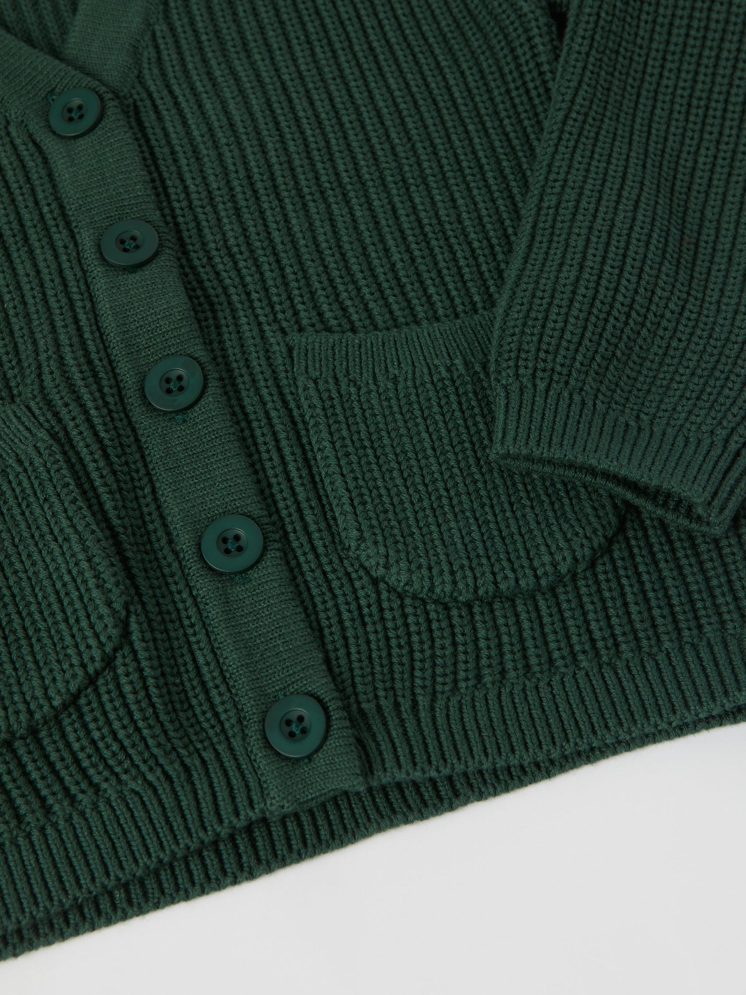 Green Ribbed Kids Cardigan from the Polarn O. Pyret kidswear collection. Clothes made using sustainably sourced materials.