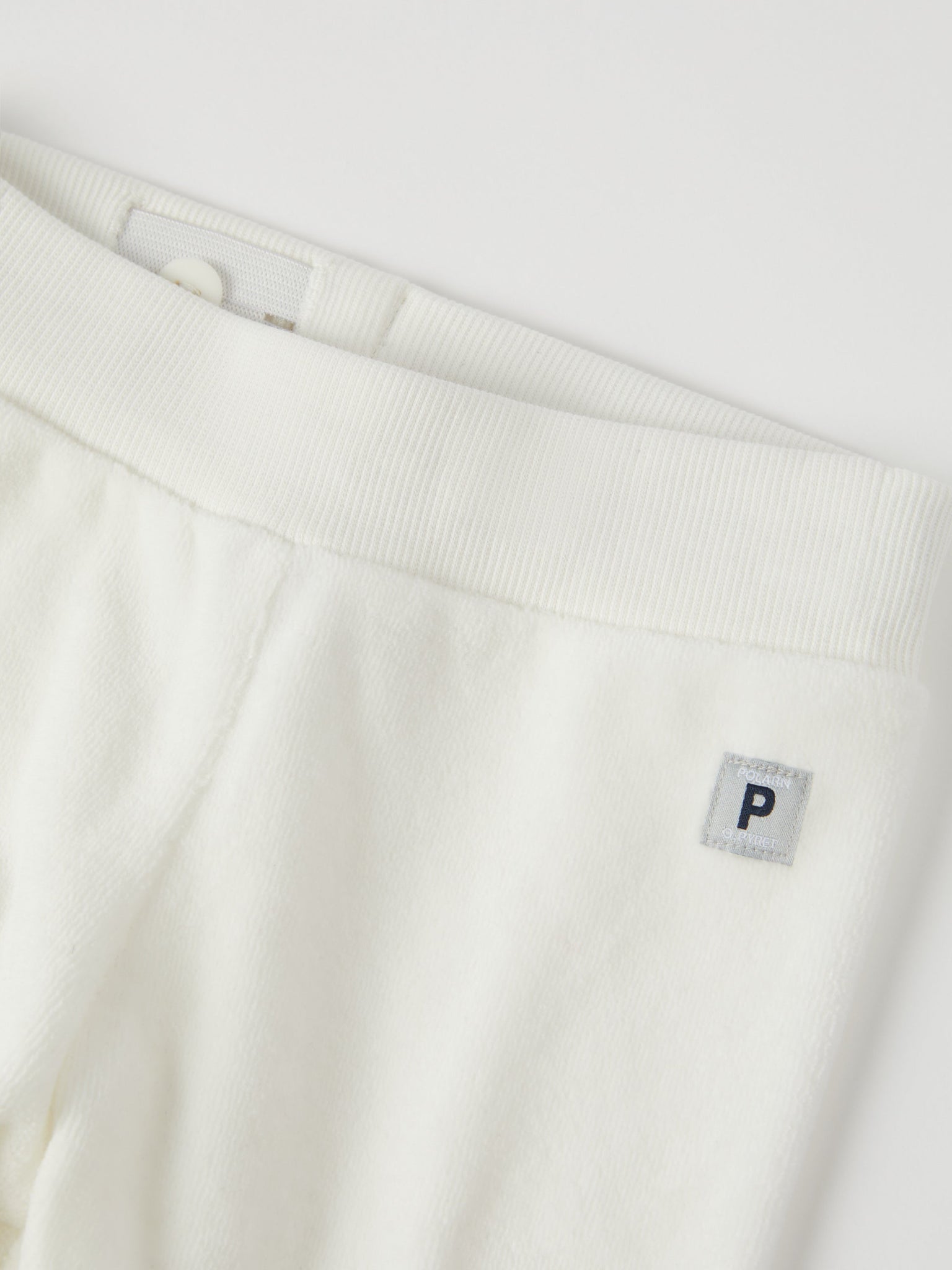 White Velour Baby Trousers from the Polarn O. Pyret baby collection. Nordic kids clothes made from sustainable sources.