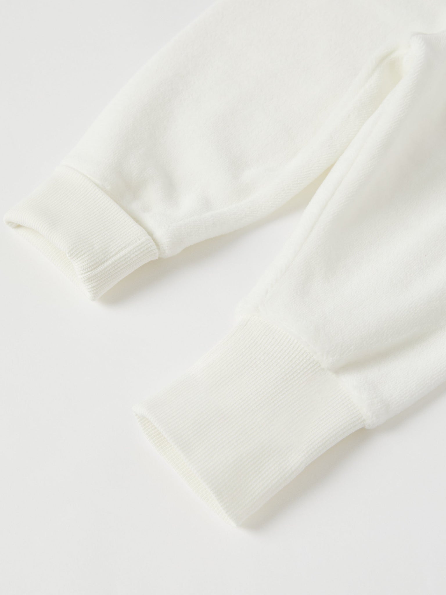 White Velour Baby Trousers from the Polarn O. Pyret baby collection. Nordic kids clothes made from sustainable sources.