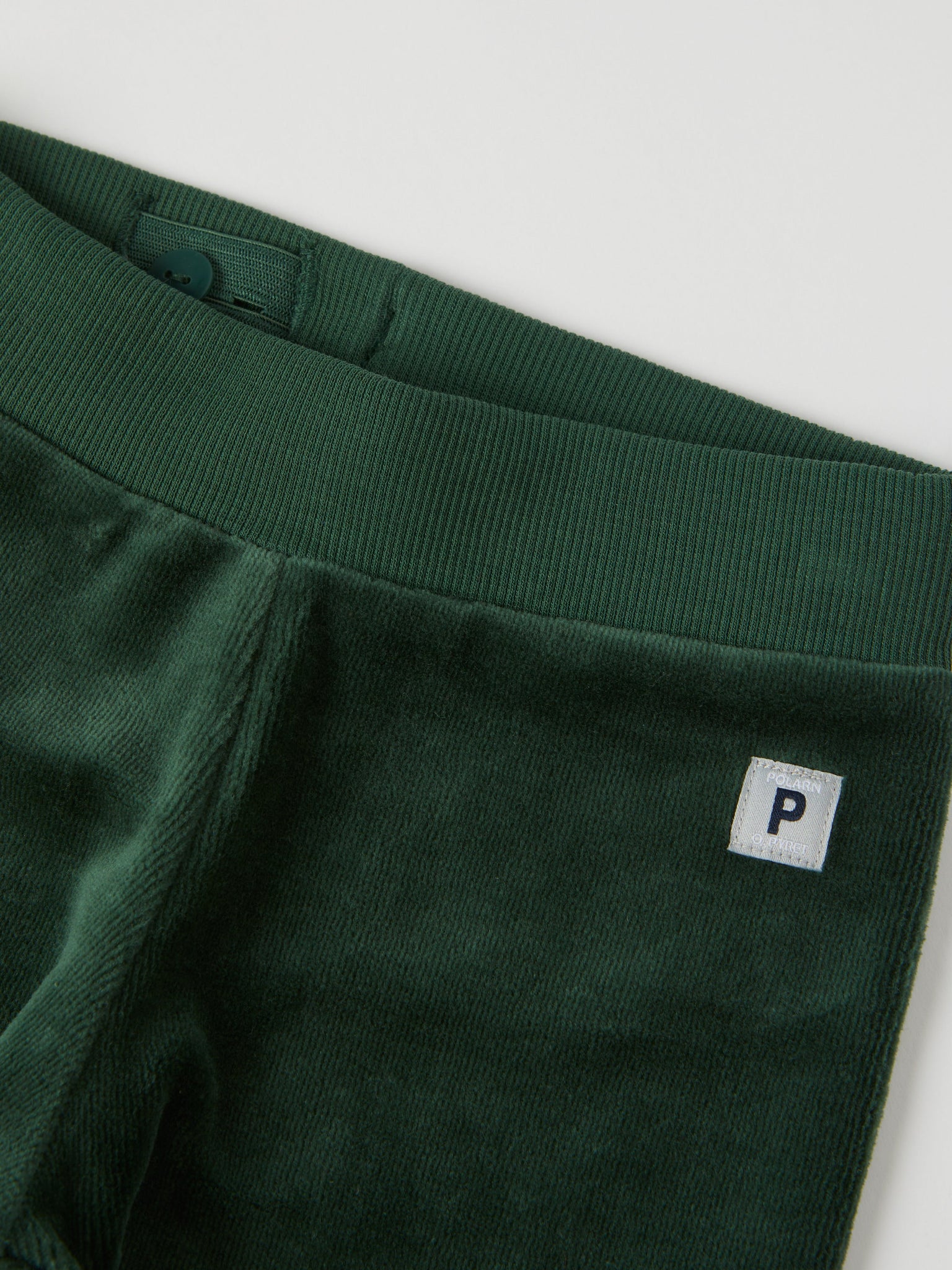 Green Velour Baby Trousers from the Polarn O. Pyret baby collection. Clothes made using sustainably sourced materials.