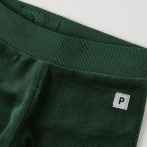 Green Velour Baby Trousers from the Polarn O. Pyret baby collection. Clothes made using sustainably sourced materials.