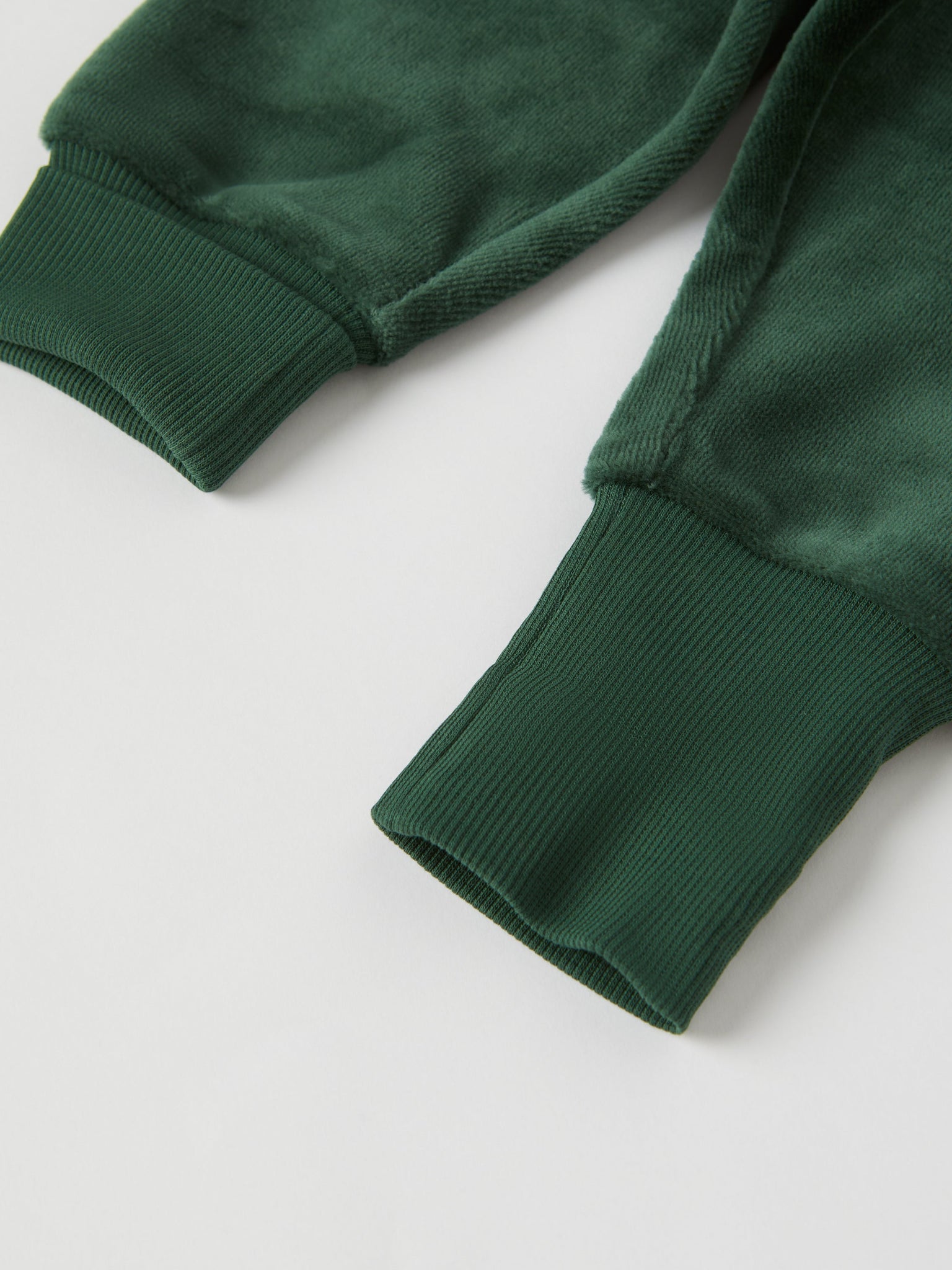 Green Velour Baby Trousers from the Polarn O. Pyret baby collection. Clothes made using sustainably sourced materials.