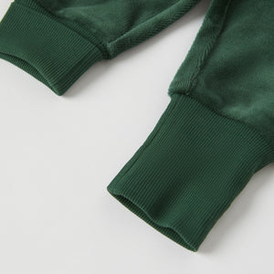 Green Velour Baby Trousers from the Polarn O. Pyret baby collection. Clothes made using sustainably sourced materials.