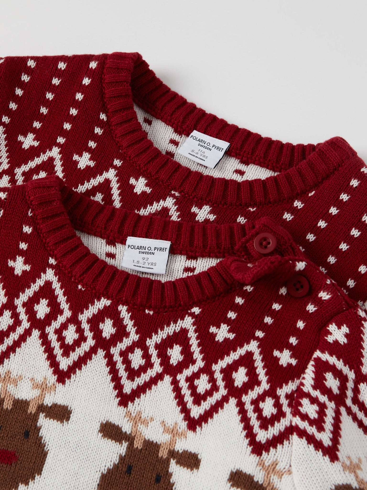 Red Reindeer Fairisle Kids Jumper from the Polarn O. Pyret kidswear collection. Nordic kids clothes made from sustainable sources.