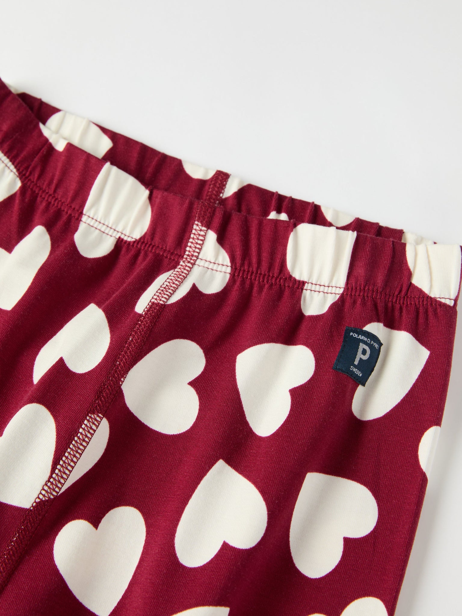 Heart Print Kids Pyjamas from the Polarn O. Pyret kidswear collection. Nordic kids clothes made from sustainable sources.